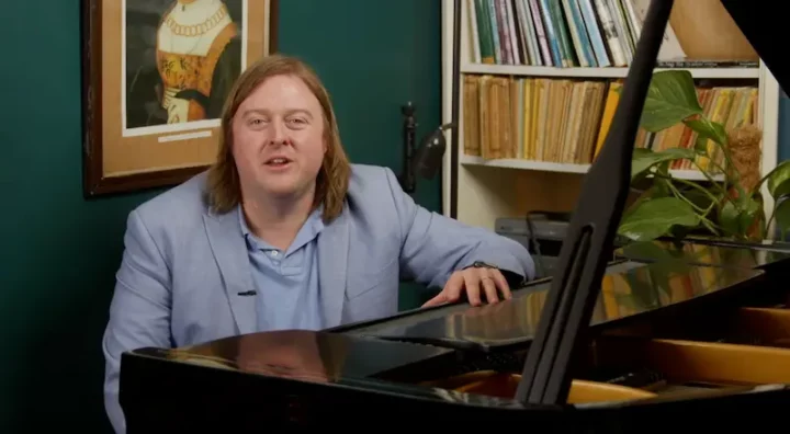 Tom Donald sat at his piano